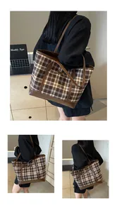 Macro detail of checkered tote bag featuring vintage leather trim and dog embroidery
