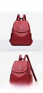 Detail view of wine red lychee grain leather backpack with kangaroo logo and side pocket