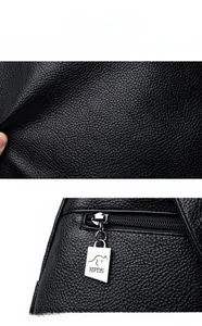 Detail of lychee textured leather backpack with silver zipper and kangaroo logo tag