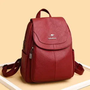 Burgundy litchi grain leather backpack for women featuring flap and kangaroo metal logo