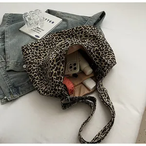 Detailed internal view of leopard print canvas tote bag showing its large storage capacity