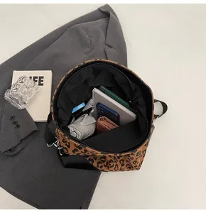 Interior view of leopard print tote bag showing large capacity with daily essentials