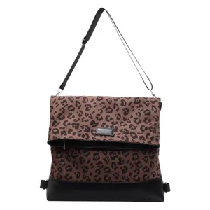 Chic leopard print shoulder bag with black leather trim and adjustable strap for women