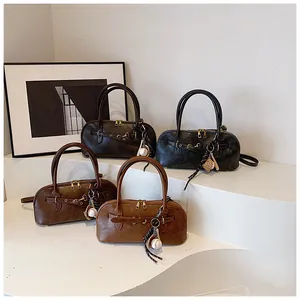 Detailed collection of retro shell handbags in four colors with leather strap accents