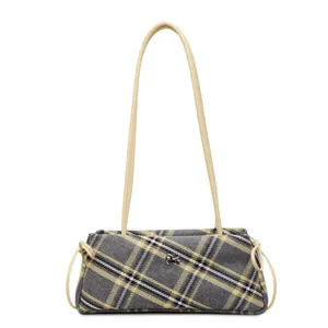 Detail of checkered shoulder bag featuring metallic logo and drawstring side accents