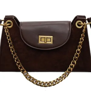 Chic leopard print baguette bag with brown suede finish and chunky gold chain strap