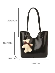 Large black patent leather tote bag with plush bear charm and handle dimensions shown