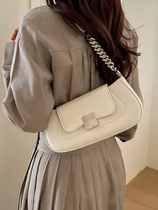 Chic beige baguette shoulder bag with chunky metal chain and silver square clasp