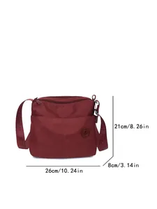 Burgundy nylon crossbody tote bag with multi-pocket design and wide logo shoulder strap