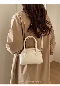 Minimalist cream textured leather baguette bag with detachable silver-tone shoulder strap