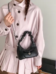 Minimalist black pleated handbag with 3D bow, heart pendant, and chain strap for women