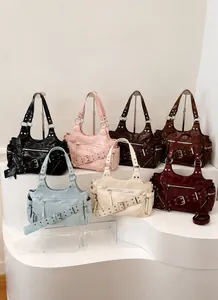 Hobo bag collection in seven colors with silver rivets and zippers in Y2K rock style