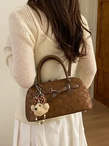 Retro deep brown shell handbag with textured matte finish and bear pendant for women