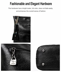 Detail van leren handtas met lychee-patroon, zilveren ritsen en beschermende bodemnoppen