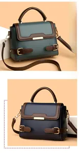 Detailed view of large-capacity handbags in green and blue with brown contrast handles