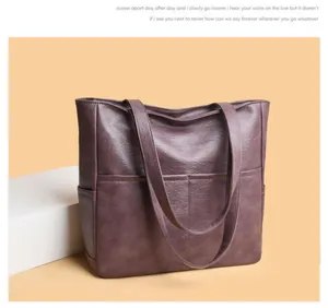 Close-up of deep purple tote bag featuring soft leather texture and side pocket detail