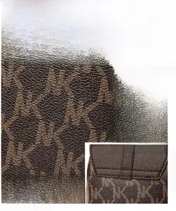 Detail showing the monogram pattern fabric and precision stitching of this mini shoulder bag