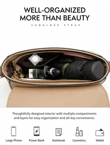 Detail view of the multi-layer interior capacity of the leather crossbody bag