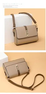 Detail of khaki leather crossbody bag showing lychee grain texture and gold metal buckle