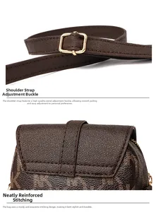 Detail of adjustable strap with gold buckle and neat stitching on brown textured bag