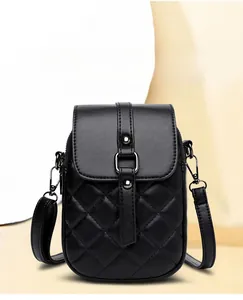 Close-up of black quilted cell phone bag with elegant diamond pattern and metallic flap closure