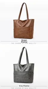 Macro shot of large capacity soft leather tote bags in brown and grey with side pockets
