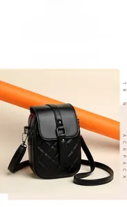 Close-up of black quilted mobile phone bag with diamond stitching and metal rivet detail
