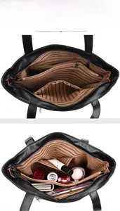 Detailed internal view of black leather tote bag with multiple compartments and lining