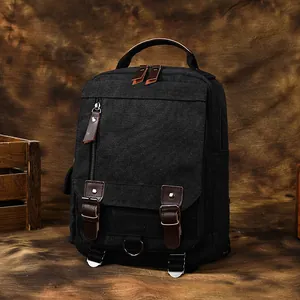 Zaino vintage in tela nera con dettagli in pelle e grande capacità per il pendolare