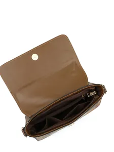Detailed interior of brown leather crossbody bag showing compartments and fabric lining