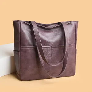 Large dark purple faux leather tote bag with pebble texture and dual shoulder straps
