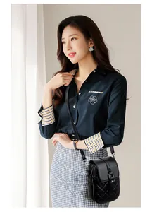 Detail of a black quilted leather crossbody bag styled with a navy blue floral shirt
