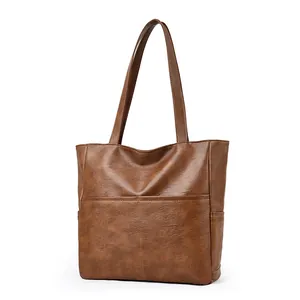 Classic vintage brown faux leather tote bag with dual front pockets and large capacity
