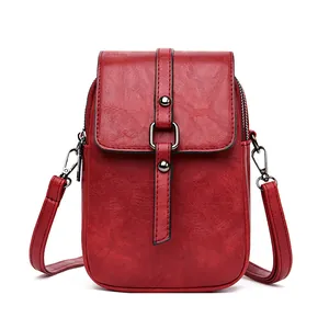 Mini borsa a tracolla rosso scuro con doppia cerniera e trama in pelle vintage