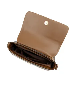 Detail view of the brown shoulder bag's interior compartments and magnetic snap closure