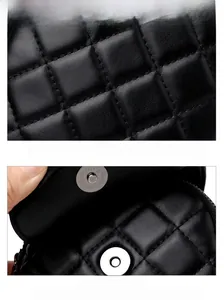 Detail of black quilted leather texture and shiny silver magnetic buckle for phone bag