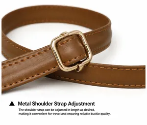 Detail of adjustable brown faux leather strap with high-quality gold metal buckle