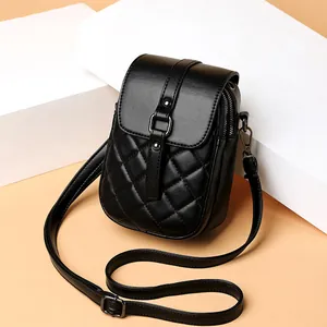 Chic black quilted mini crossbody bag for cell phone with gold-tone hardware and strap