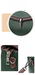 Detailed close-up of green lychee leather texture, silver metal lock, and side zipper