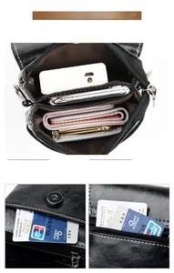 Detail view of large capacity black phone bag with zipper compartments and card slots