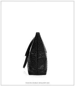 Side view of black woven tote bag with smooth synthetic leather texture and long straps