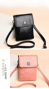 Detailed close-up of mini leather phone bags in black and pink with floral metal buckles