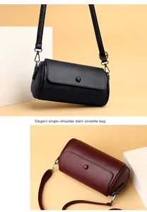 Vue détaillée des sacs à bandoulière cylindriques en noir et bordeaux avec rabat fermé