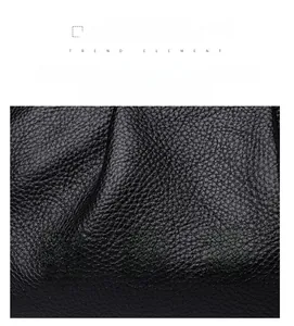 Close-up of black lychee grain leather texture with premium stitching details