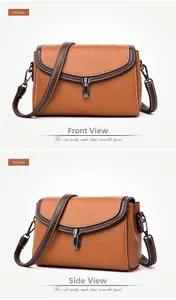 Detailed views of yellow lychee grain faux leather bag with metal buckle and contrast stitching