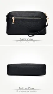 Detail view of black lychee grain leather crossbody bag showing back zipper and bottom stitching
