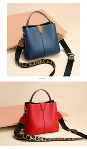 Detail of red and blue bucket bags with textured finish and decorative woven shoulder straps