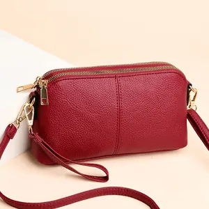 Burgundy litchi grain women's crossbody bag with double gold zippers and shoulder strap