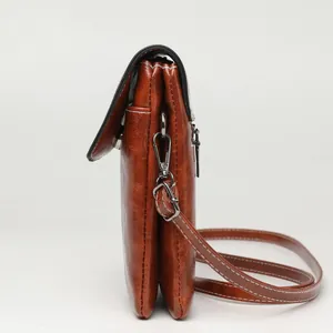Brown faux leather crossbody phone bag with vintage texture and contrast stitching