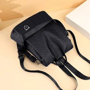 Modern black woven leather backpack for women with silver hardware and adjustable straps